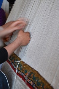 Women Weaving A Carpet